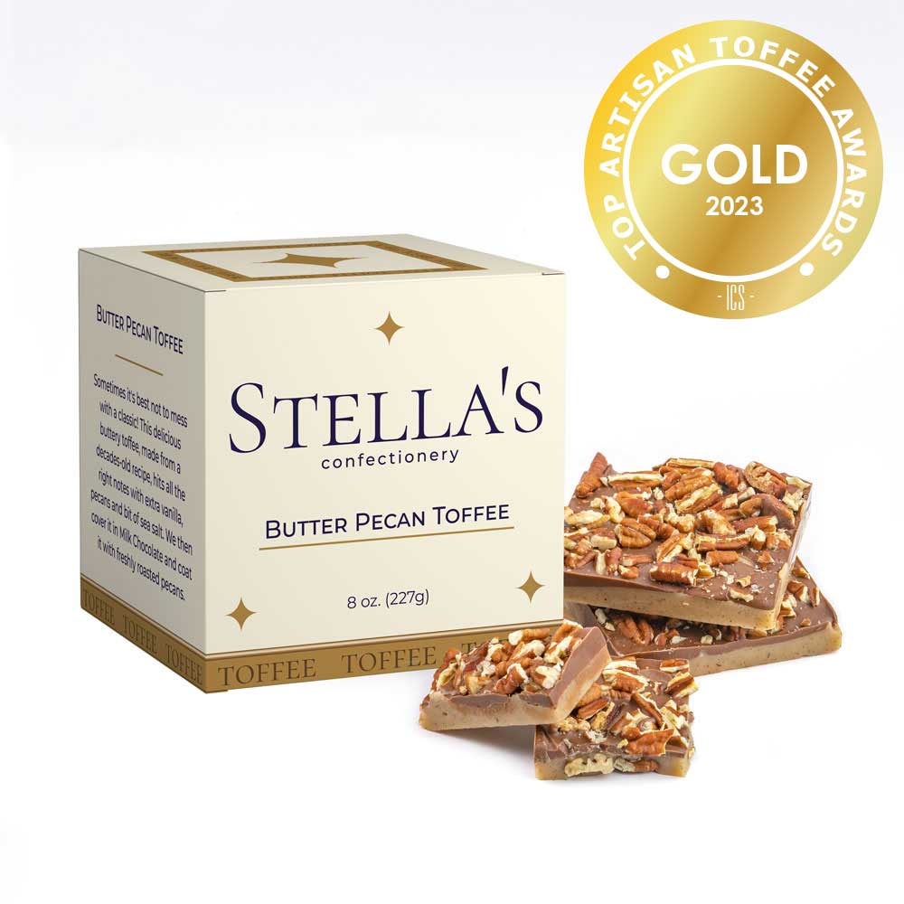 Box of Butter Pecan toffee next to toffee pieces and a gold award badge