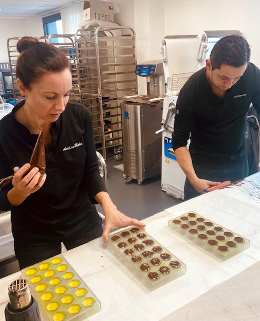 Annaluna Karkar prepping bonbons with Christophe Rull at the World Chocolate Masters 2022